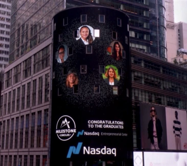 Erica's headshot displayed on the Nasdaq Tower in Times Square with other Milestone Circles graduates